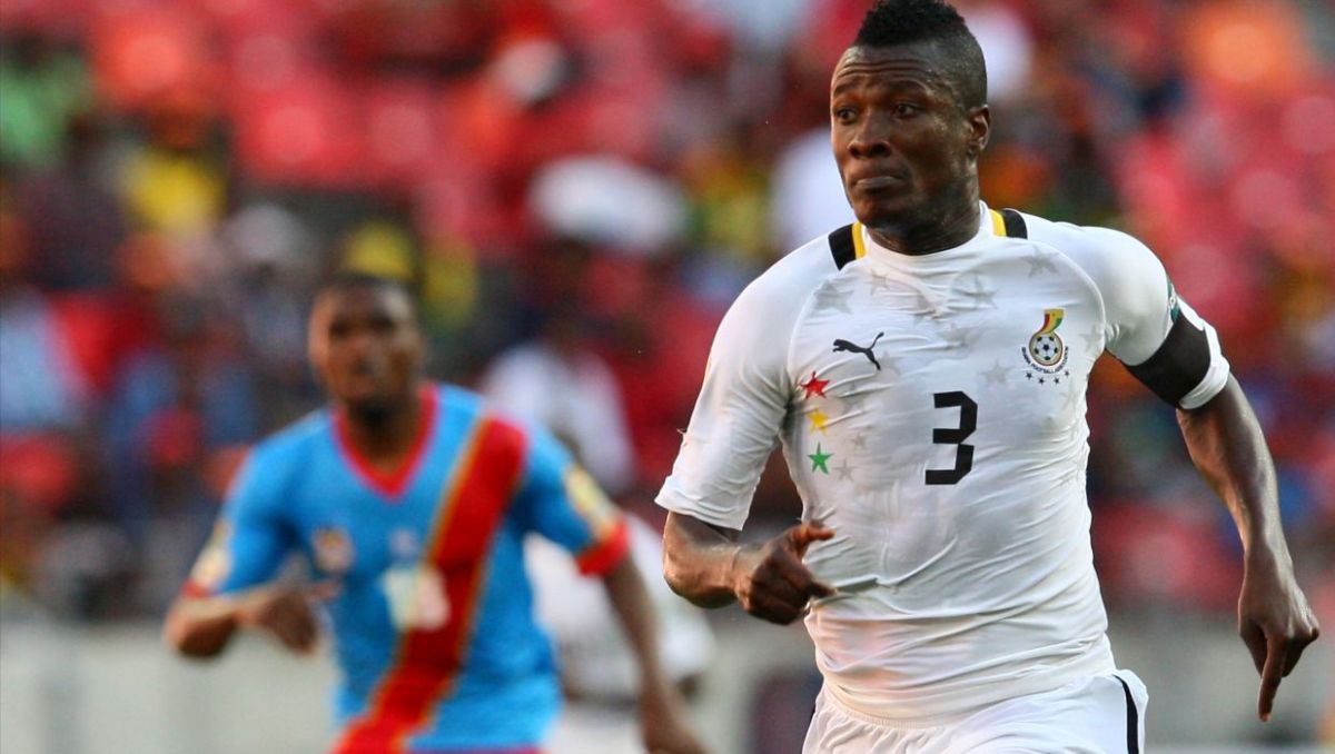 Asamoah Gyan on a football pitch