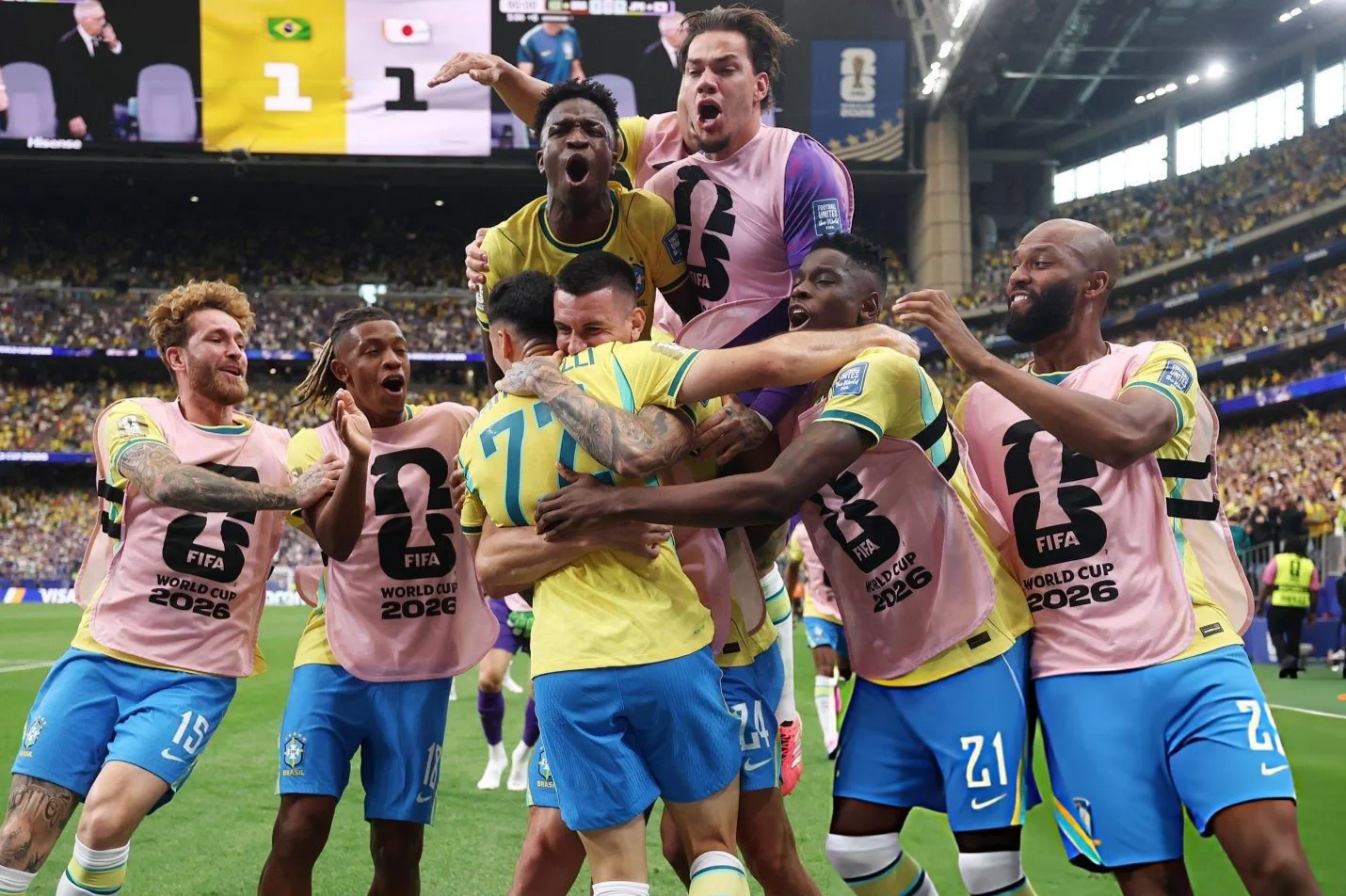 Brazil players celebrating Martinelli's winning goal