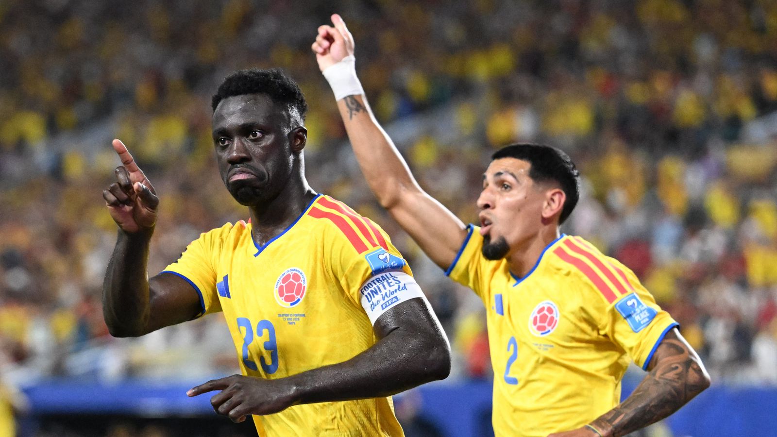 Davinson Sanchez celebrates with his teammate