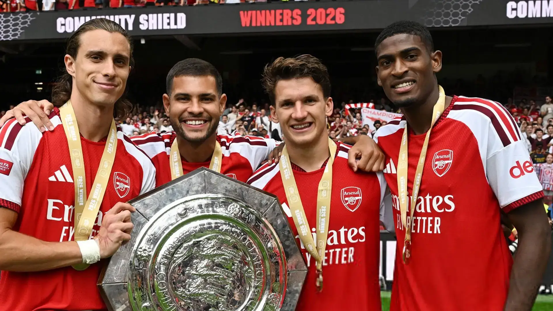 Arsenal players holding the community shield trophy